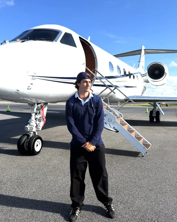 Val, co-founder of Dislo, standing in front of a private jet.